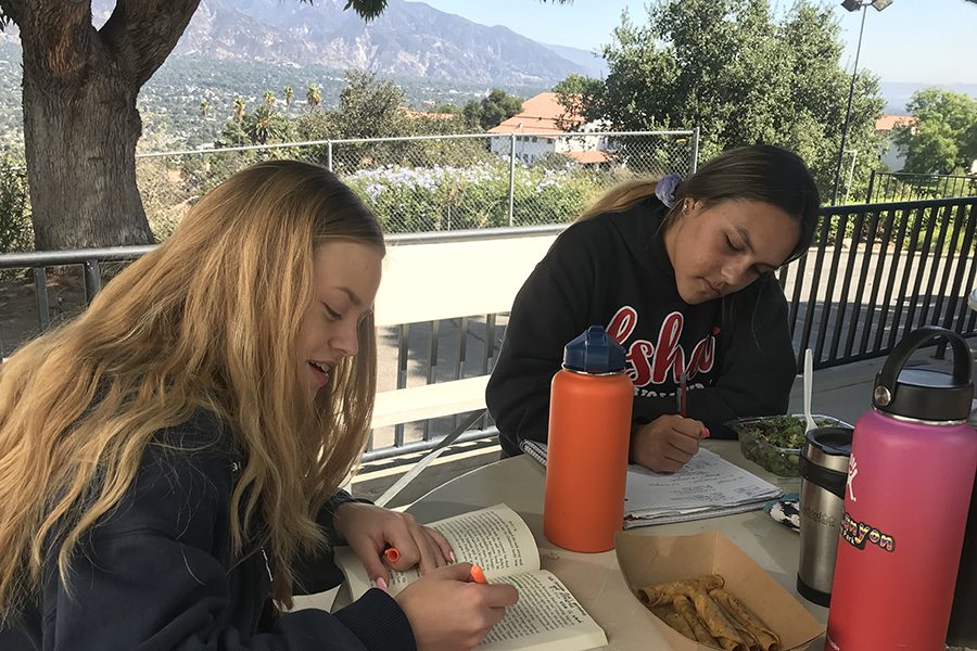 Gabi Miller 21 and Makena Wilson 21 race to finish assignments before the bell rings; the pressure of school work is a common source of teen anxiety. 
