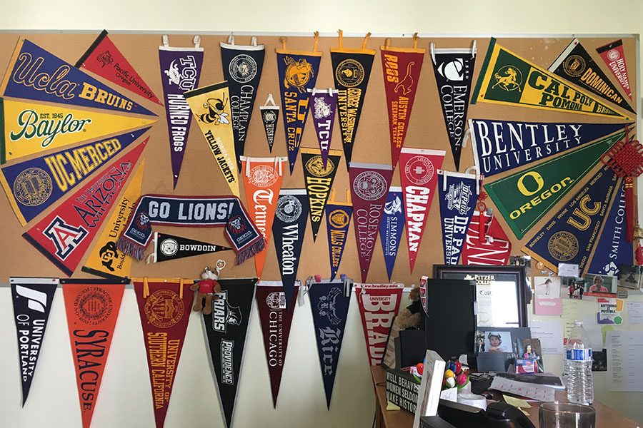 College flags fly high in the college counseling cottage.