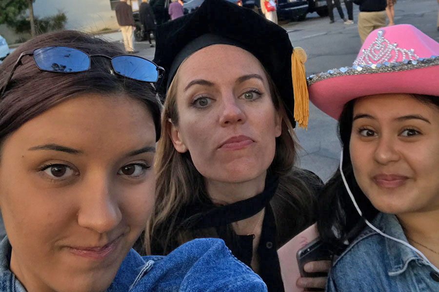 At last years graduation, Olivia Spina 20 and Kiara Hosseinion 20 take one of many memorable selfies with Ms. Wilkinson.