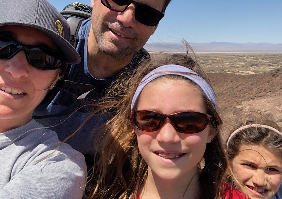 The Bilotta family takes a quick break on a hike in the Amboy Craters in San Bernardino County.