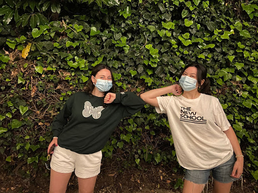 Joelle Souma 21 gives Christina Costanzo 21 a friendly elbow bump during their first get together after quarantine. 