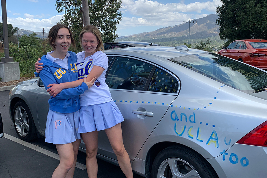 Here I am on the left with Claire McDonald 21, the Shield’s managing editor and my right-hand woman. It wasnt too long ago that we were the only sophomores in Journalism. (By the way, thanks, Claire, for allotting me a corner of your car to decorate.)