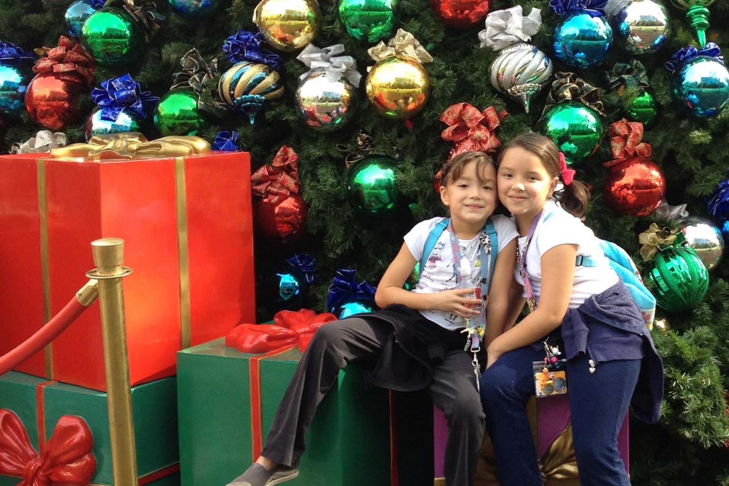 Sisters Lina Urquiza ‘22 and Siena Urquiza ‘23 smile for a photo in Downtown Disney just a few days before Christmas of 2015.