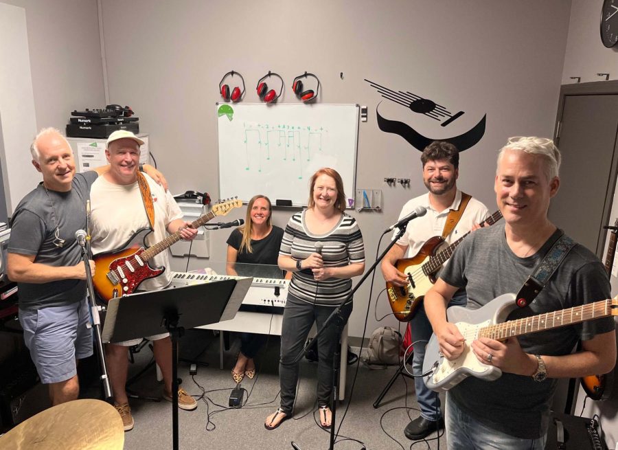 Sra. Cote and her band pose for a photo during one of their weekly Tuesday night practices.