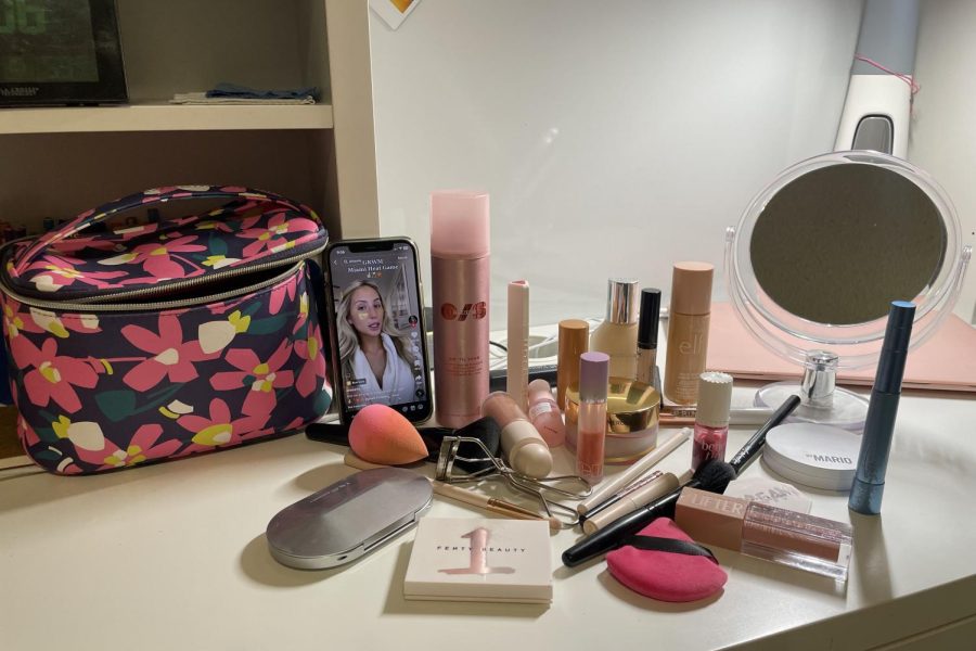 Graciela Tiu ‘23 lays out her makeup while watching an Alix Earle TikTok video. 