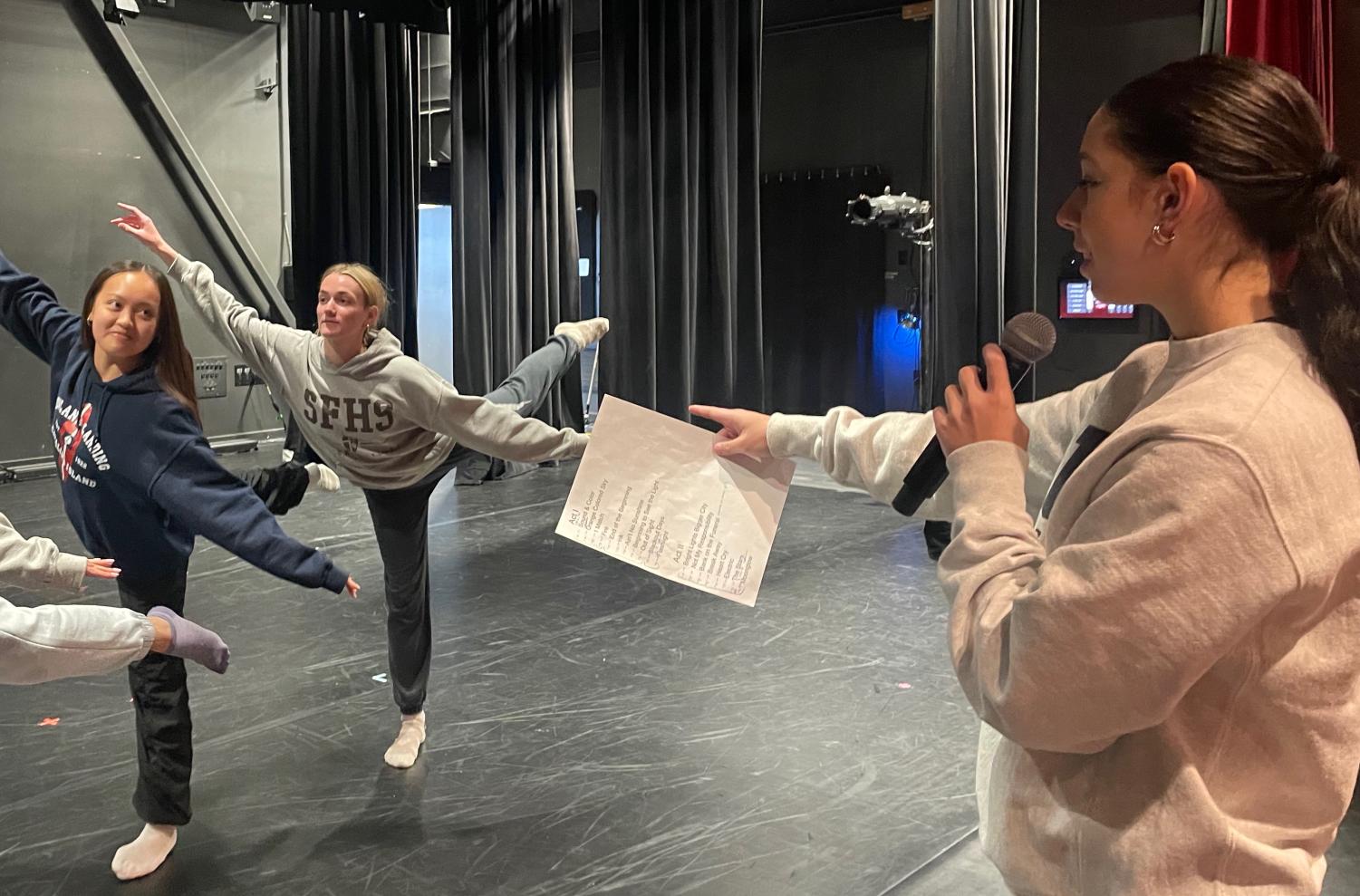 Sophia Garcia ‘24 works with her cast during tech week the day before opening night of the dance concert.
