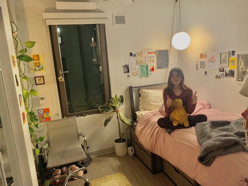 Ella Minton ‘22 is sitting on the bed in her UC Berkeley dorm.