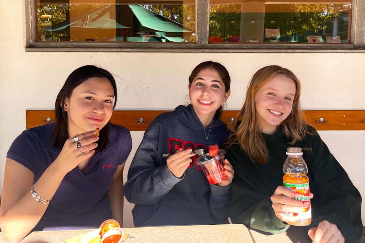 Seniors Ava Barraza, Maya Oktanyan and Abby Hardy pictured enjoying their food during lunch. Photo by Alina Perez 24.