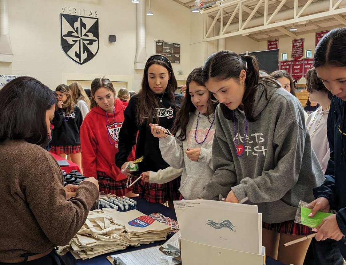 Students eagerly line up to register to vote at the voting information assembly. Photo by Mr. Jonathan Harper