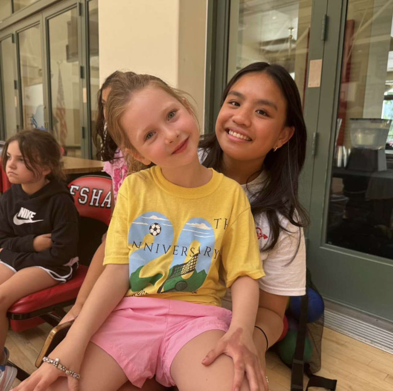 Lauren Cabatuando ’25 with one of her campers. Photo from Lauren Cabatuando '25. 
