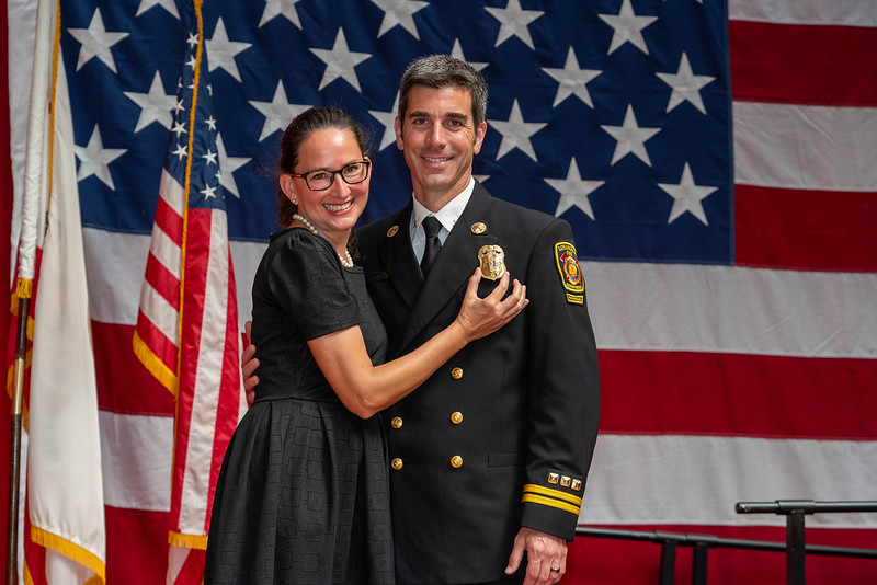 Mrs. Marlena Conroy and Mr. Matthew Conroy at the ceremony for his promotion to Battalion Chief. Photo credits to Marlena Conroy. 
