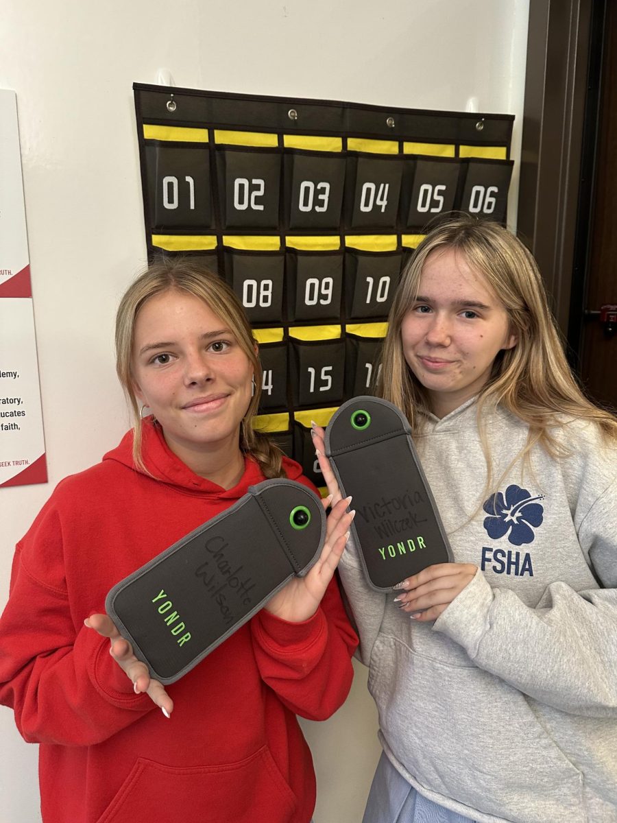 Charlotte Wilson '27 and Victoria Wilczek '27 seen posing with their Yondr pouches. Photo credit to Charlotte Wilson '27.