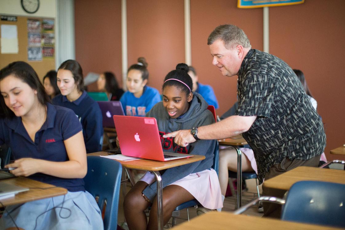 A Tolog works on a laptop, reflecting how technology is a regular part of school life. Photo by Private School Review.