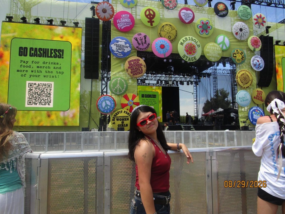 Grace Lee ‘29 posing in front of the stage at the completely women-led festival!