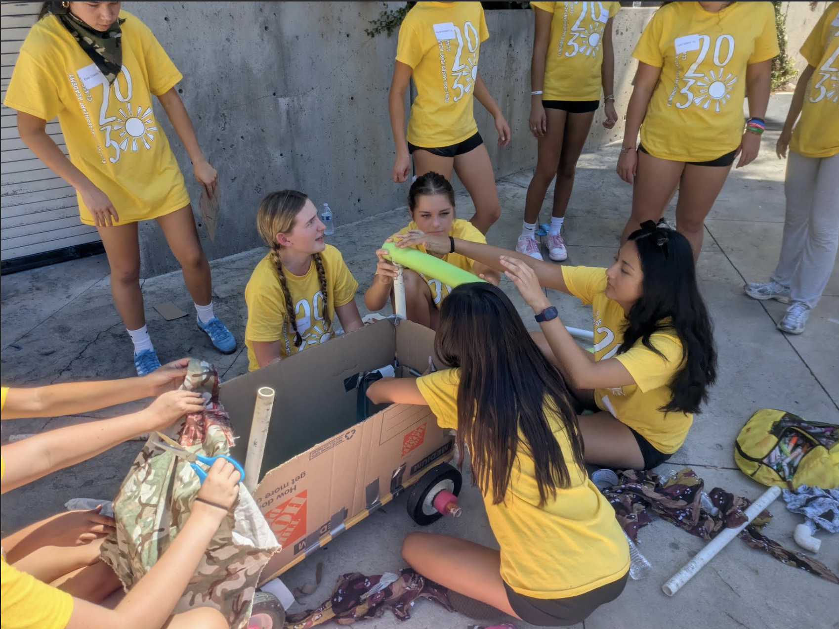 Tologs using team work to build a makeshift boat